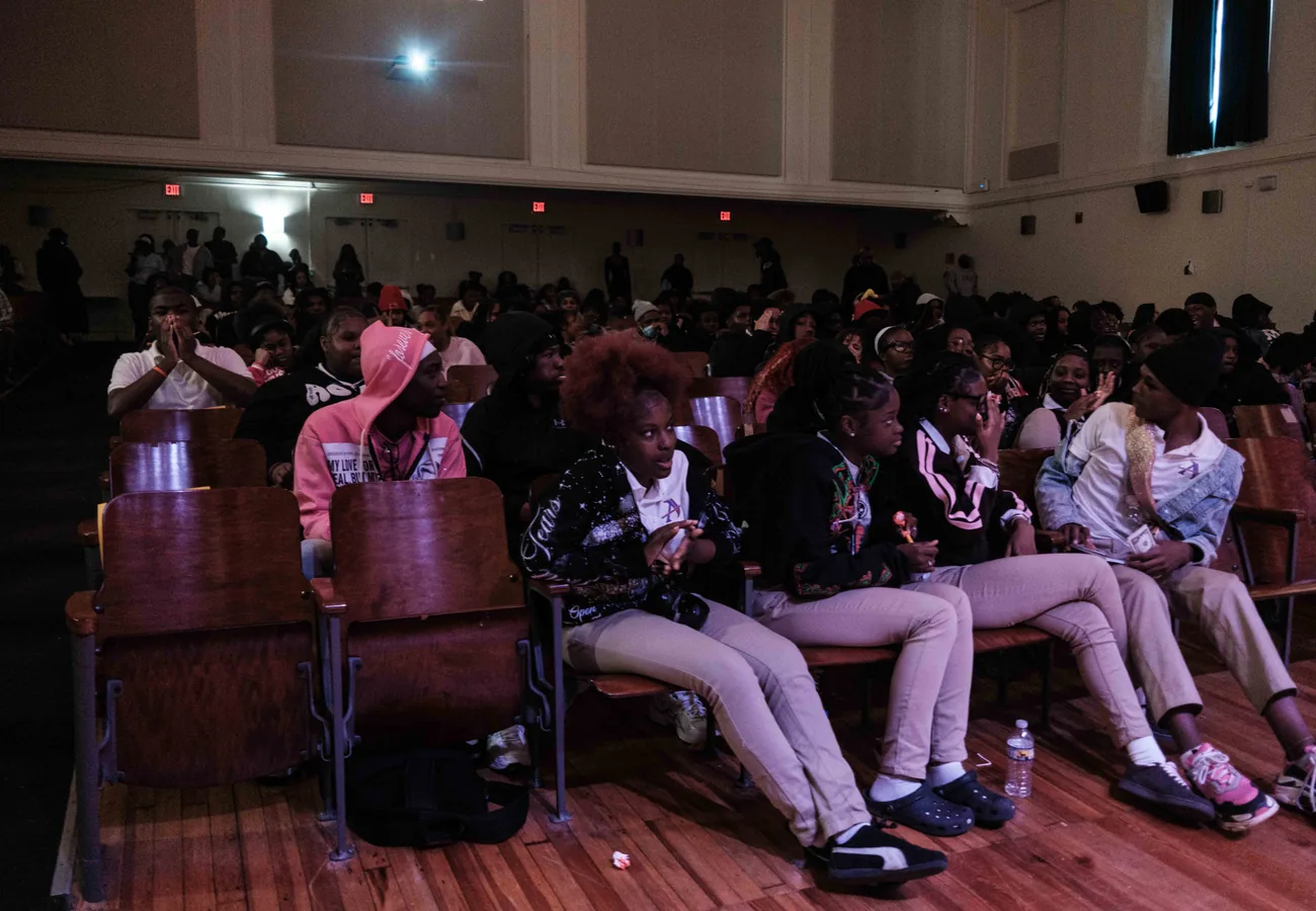 Students and community members participating in a school-wide Crowns event.